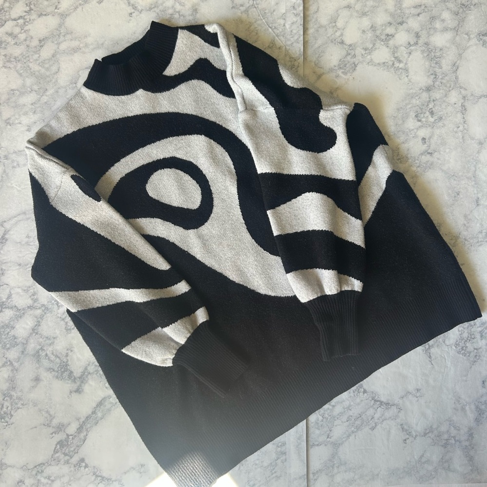 Black and White Crewneck Sweater with Dynamic Abstract Design